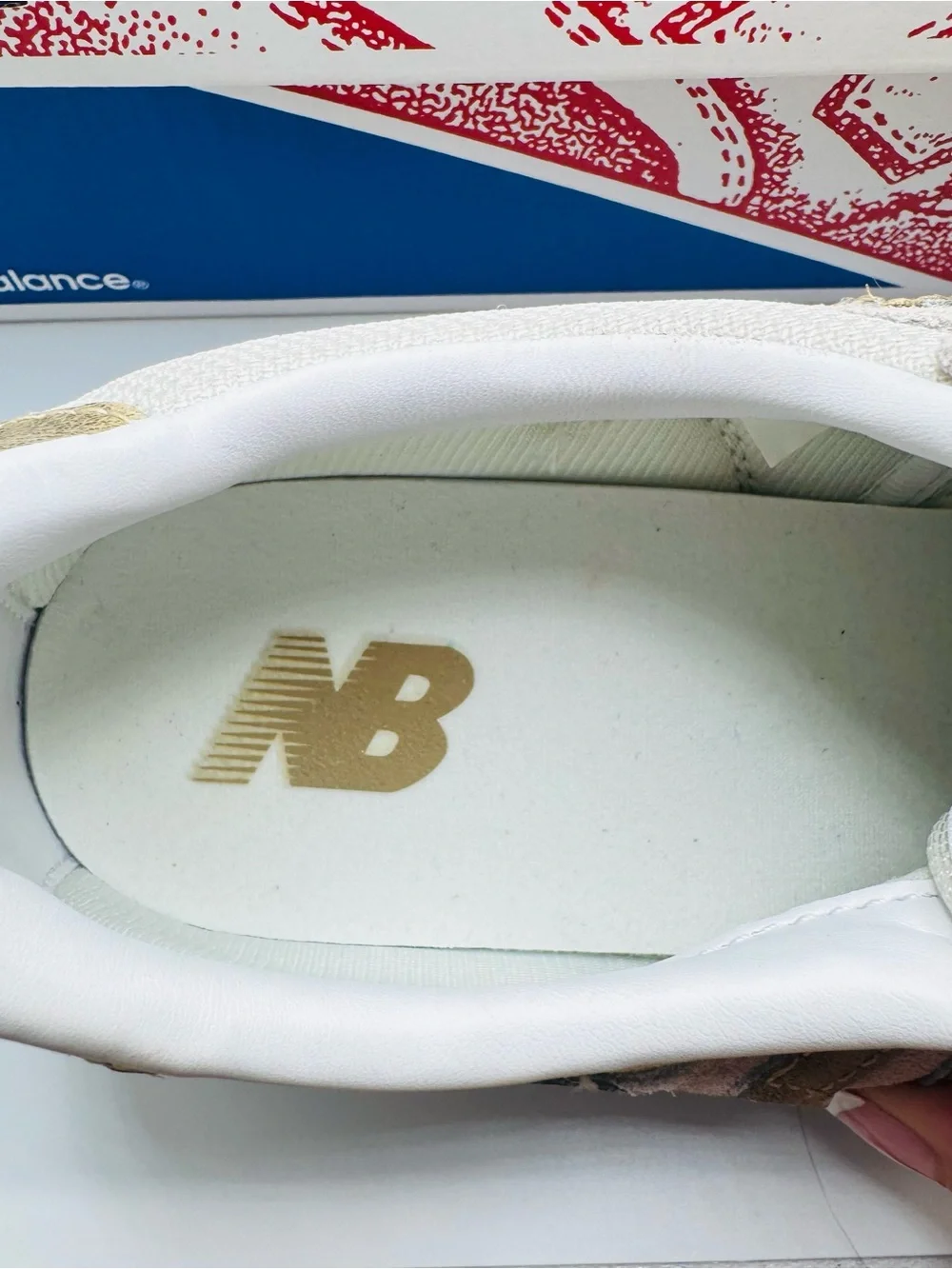 New Balance Women’s White Sneakers with Gold Accents